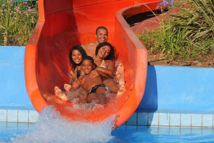 Friends doing slides at Acqua Plus Waterpark